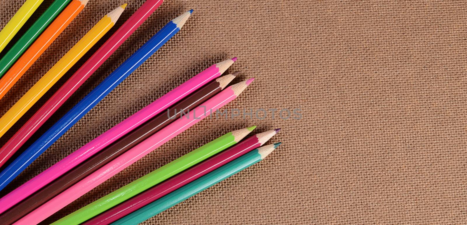 Color pencils on a board. School concept