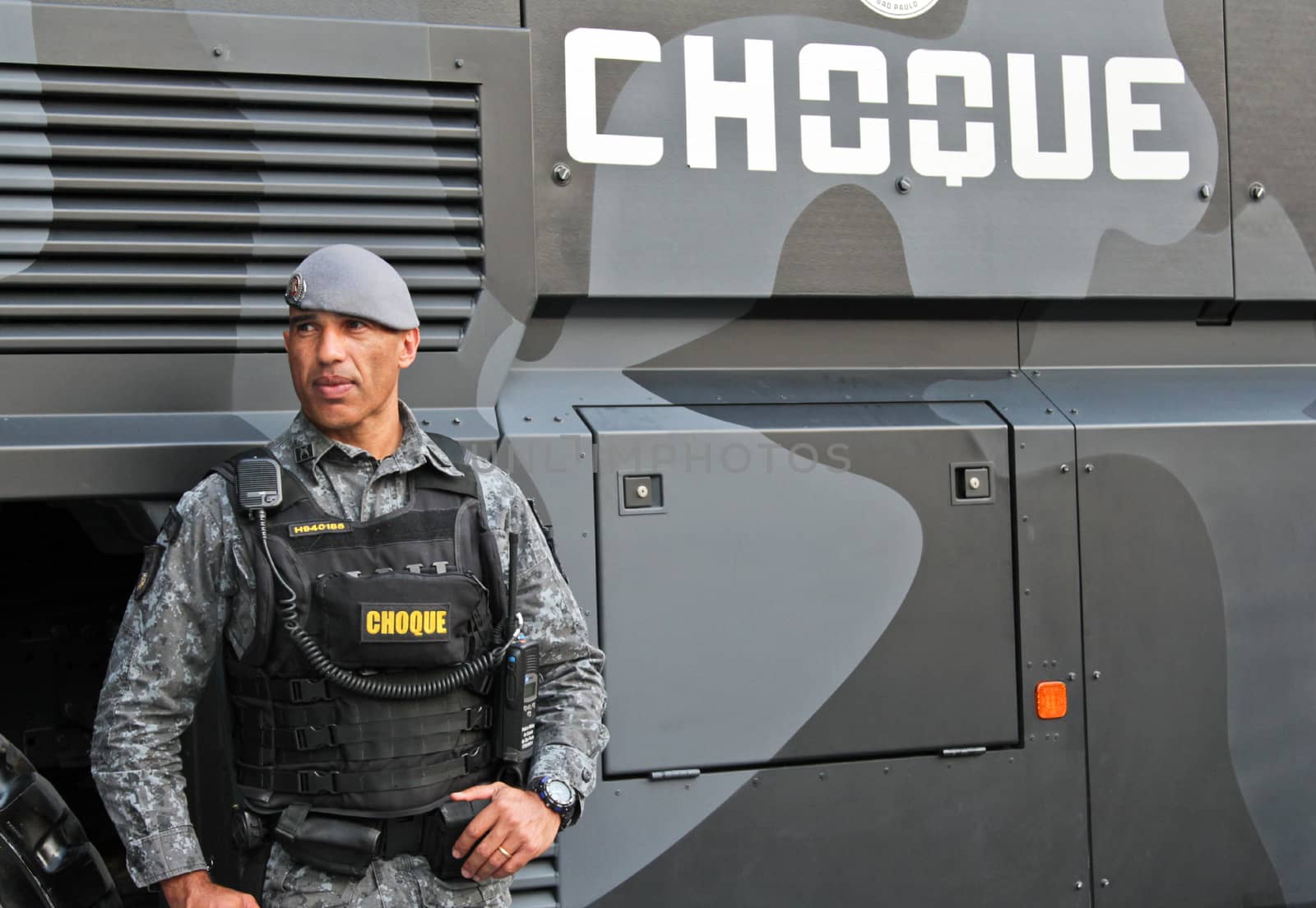 SAO PAULO, BRAZIL August 16, 2015: An unidentified cop takes care of security in the protest against federal government corruption in Sao Paulo Brazil. Protesters call for the impeachment of President Dilma Rousseff.