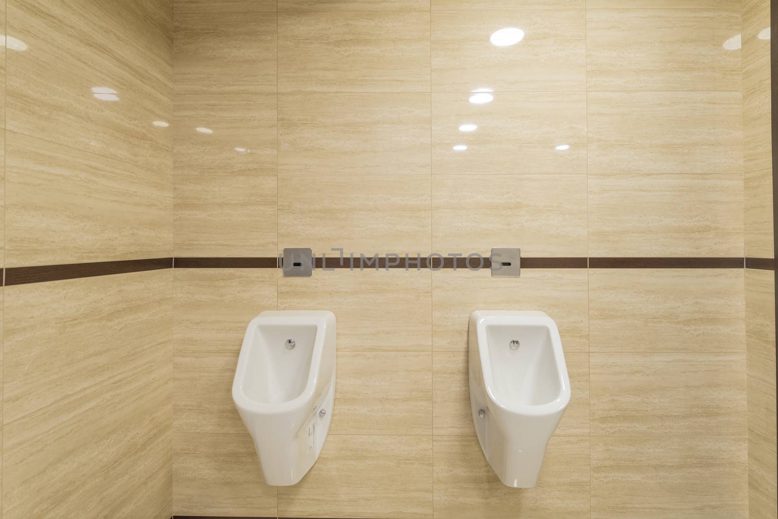 Men standing urinals in WC