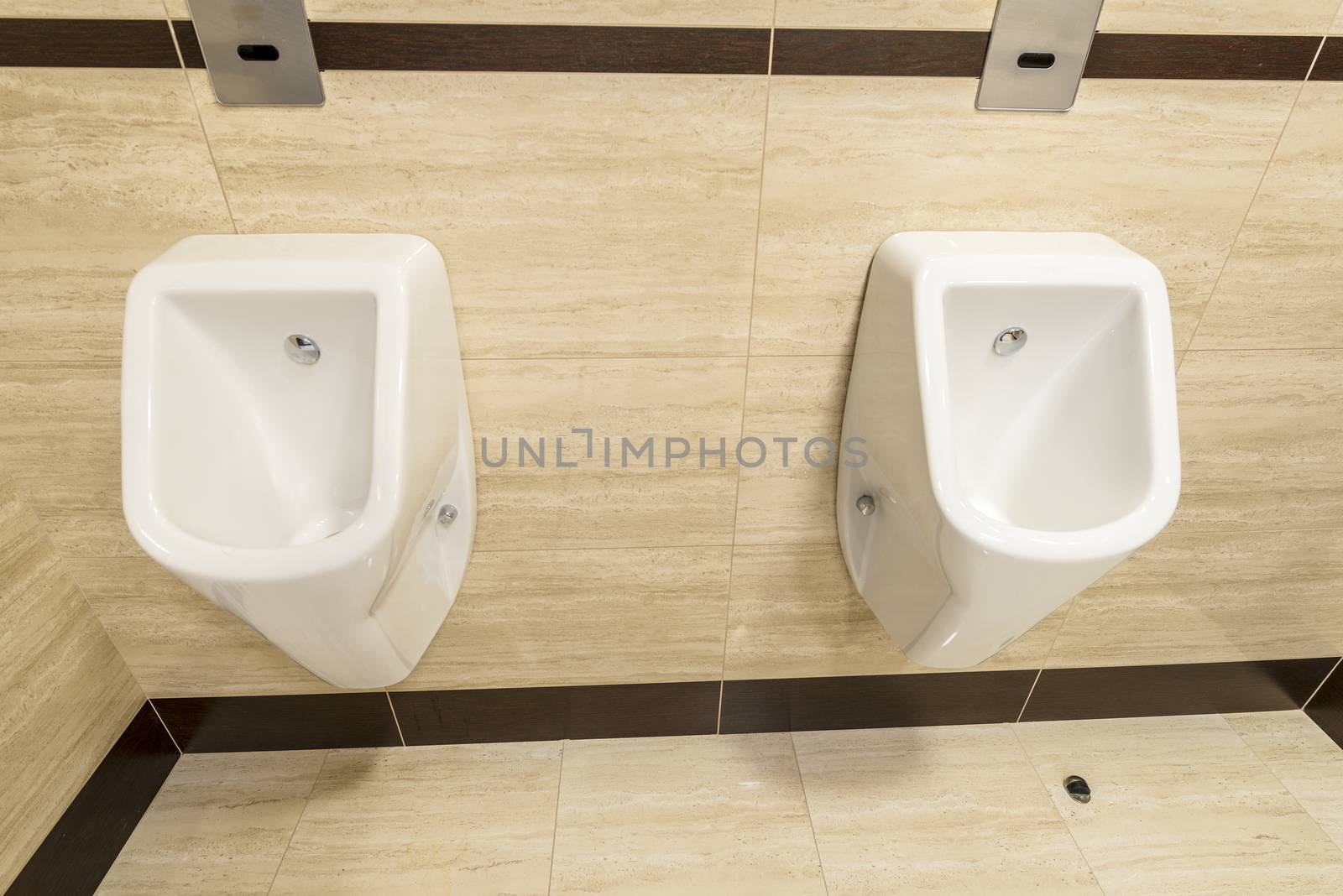 Men standing urinals in WC by rogkoff