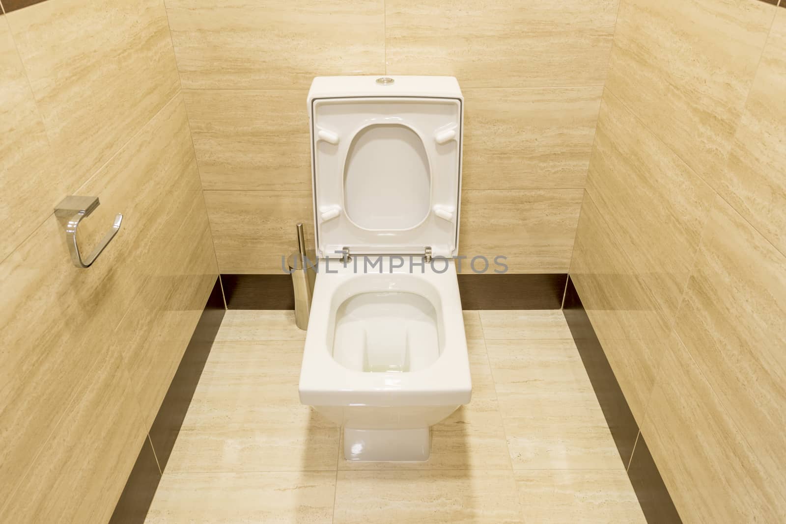 White toilet in the interior of the restroom by rogkoff