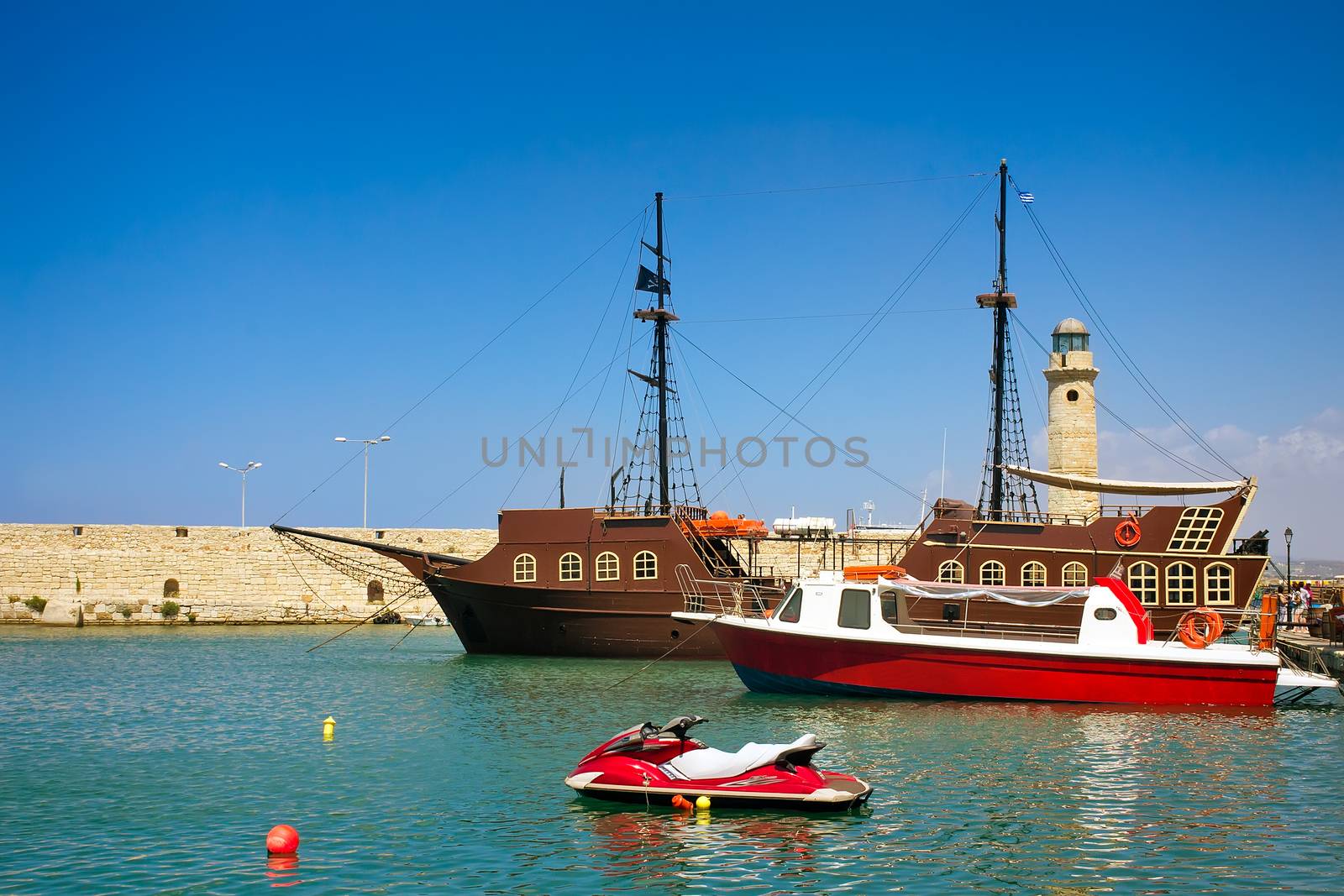 Views of the port and the lighthouse, the town of Rethymno, Cret by georgina198