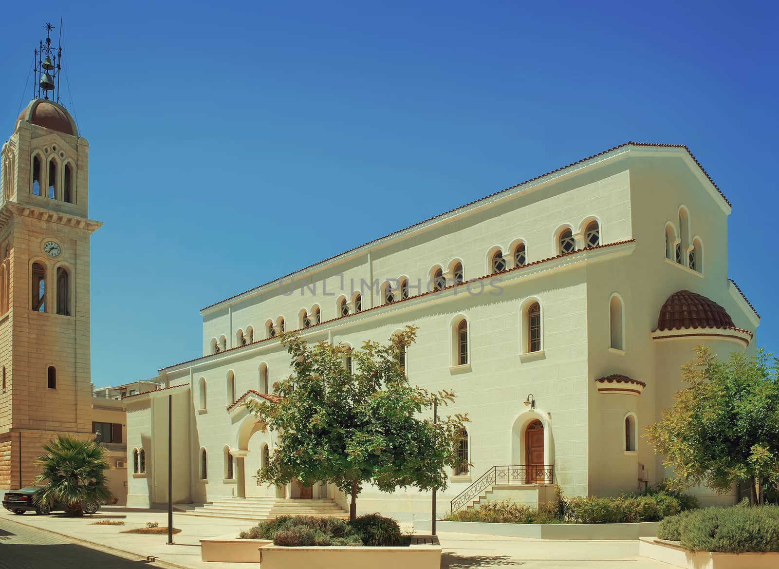 Buildings, trees and other plants in the Central square of the city of Rethymno, Crete, Greece.