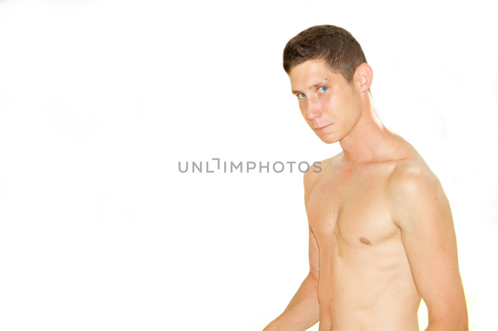 Teenager without shirt on isolated background with free copyspace.