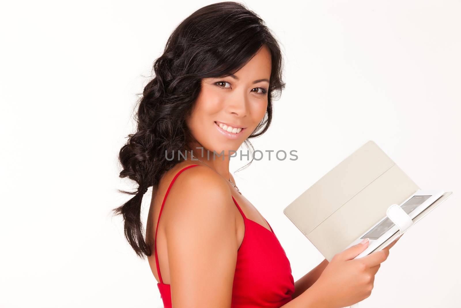 Young brunette woman reading the electronic book on isolated background
