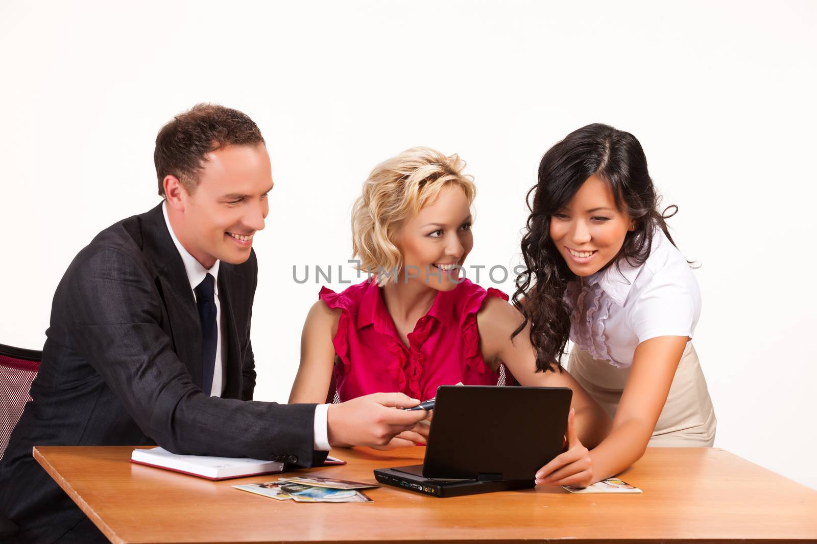 Three young people watching the video on a portable DVD player