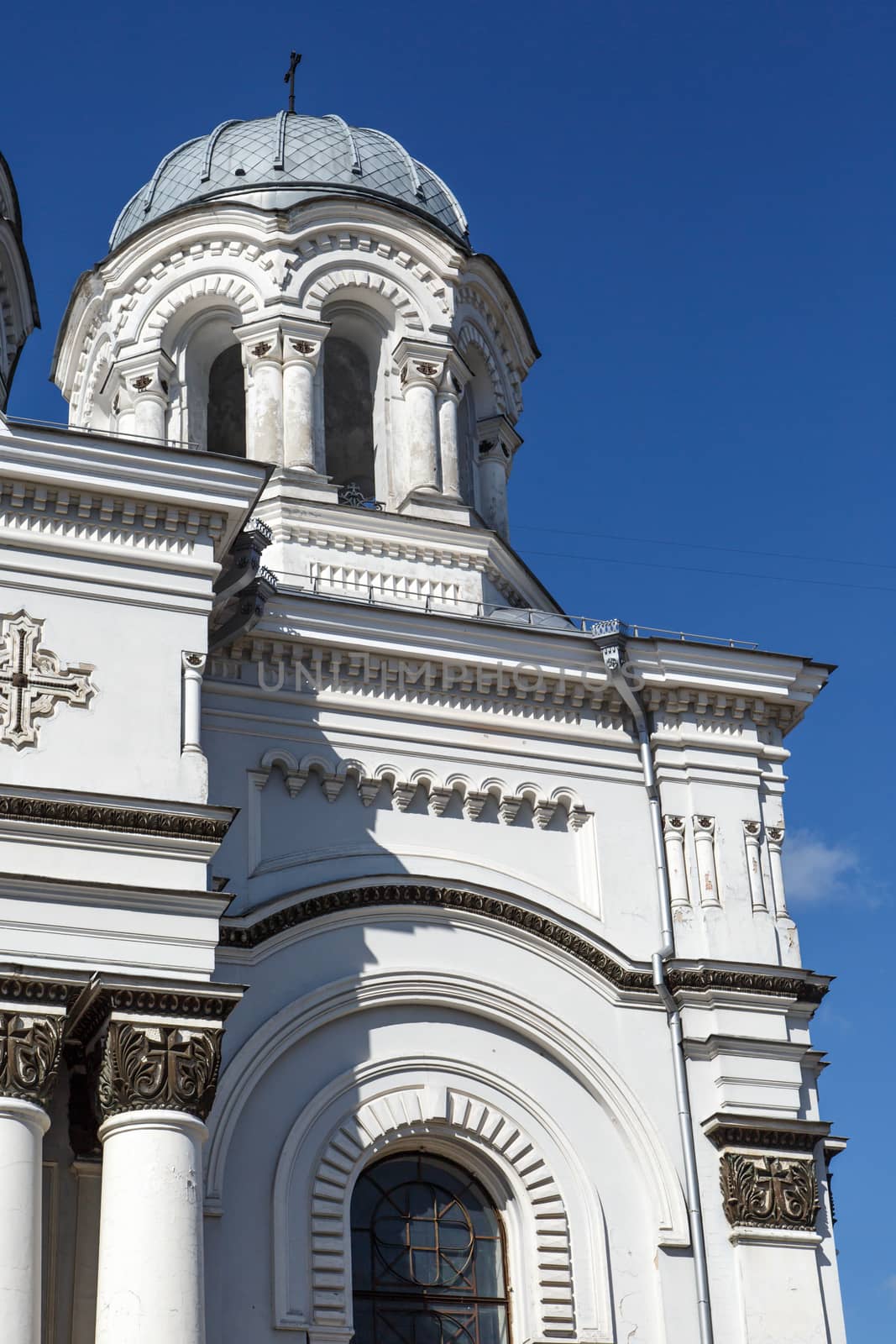 Close up view of catholic roman church named St Micheal the Archangel in Kaunas, on clear navy blue sky background.