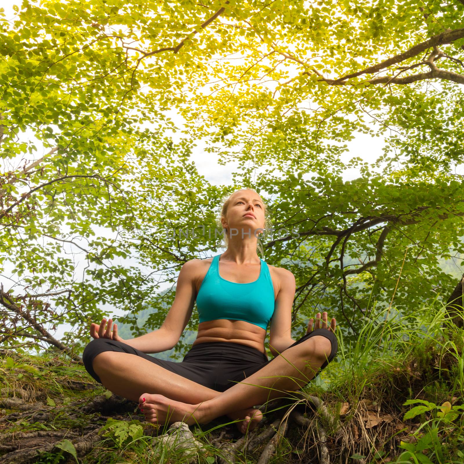 Woman relaxing in beautiful nature. by kasto