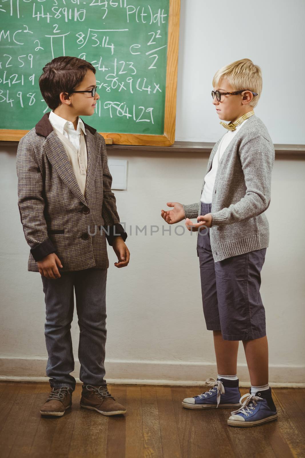 Pupils dressed up as teachers in a classroom in school