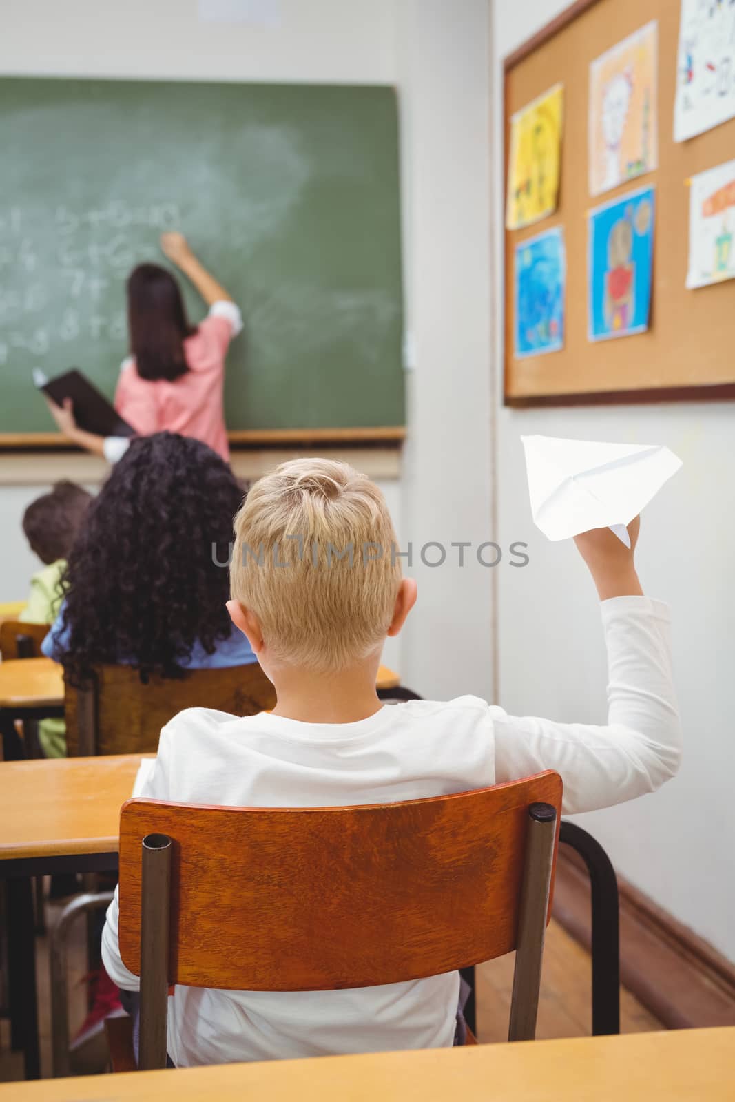 Student about to throw a paper airplane by Wavebreakmedia