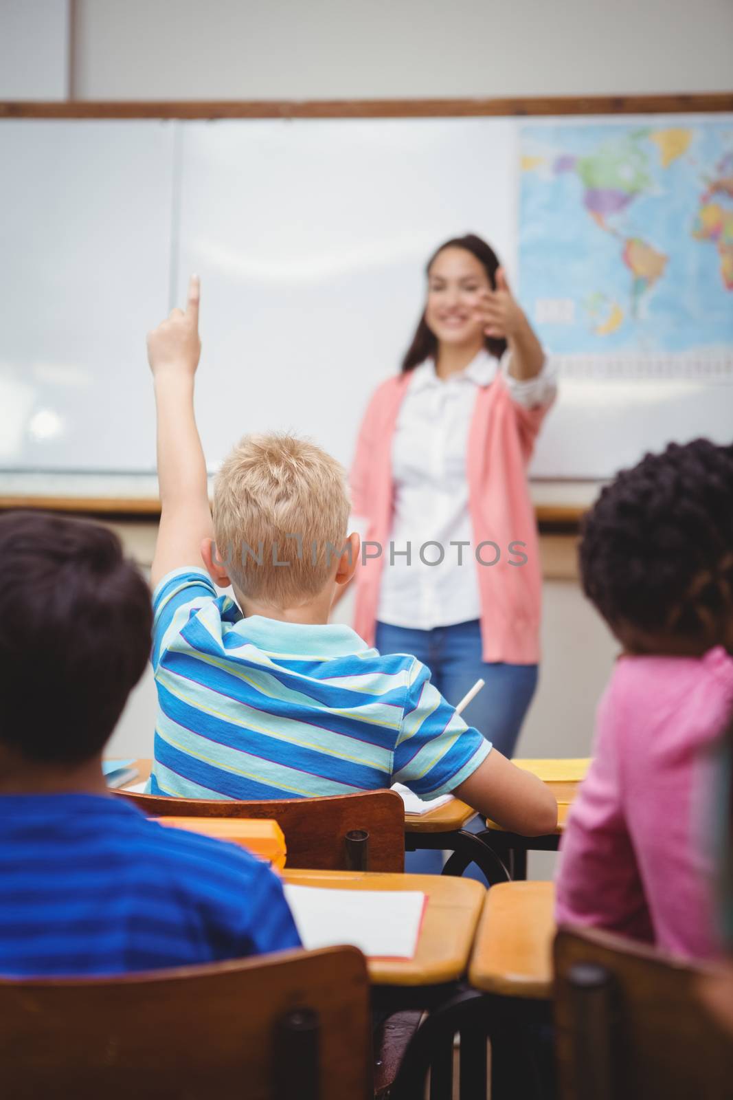 Student raising hand to ask a question by Wavebreakmedia