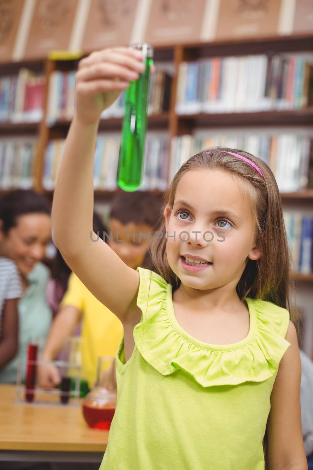 Pupil doing science in library at the elementary school