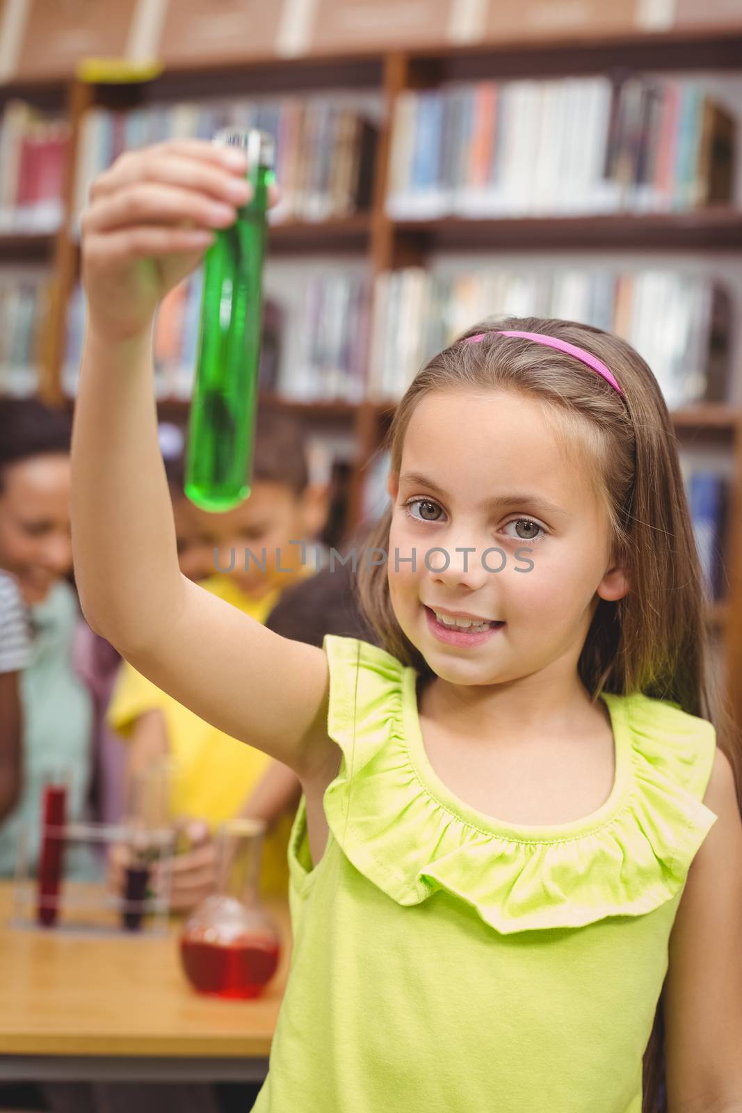 Pupil doing science in library by Wavebreakmedia