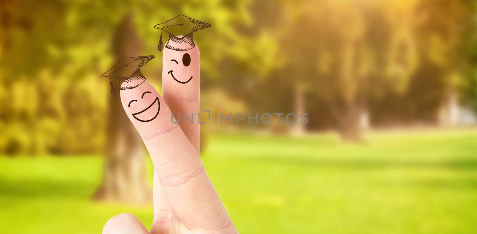 Fingers posed as students against trees and meadow