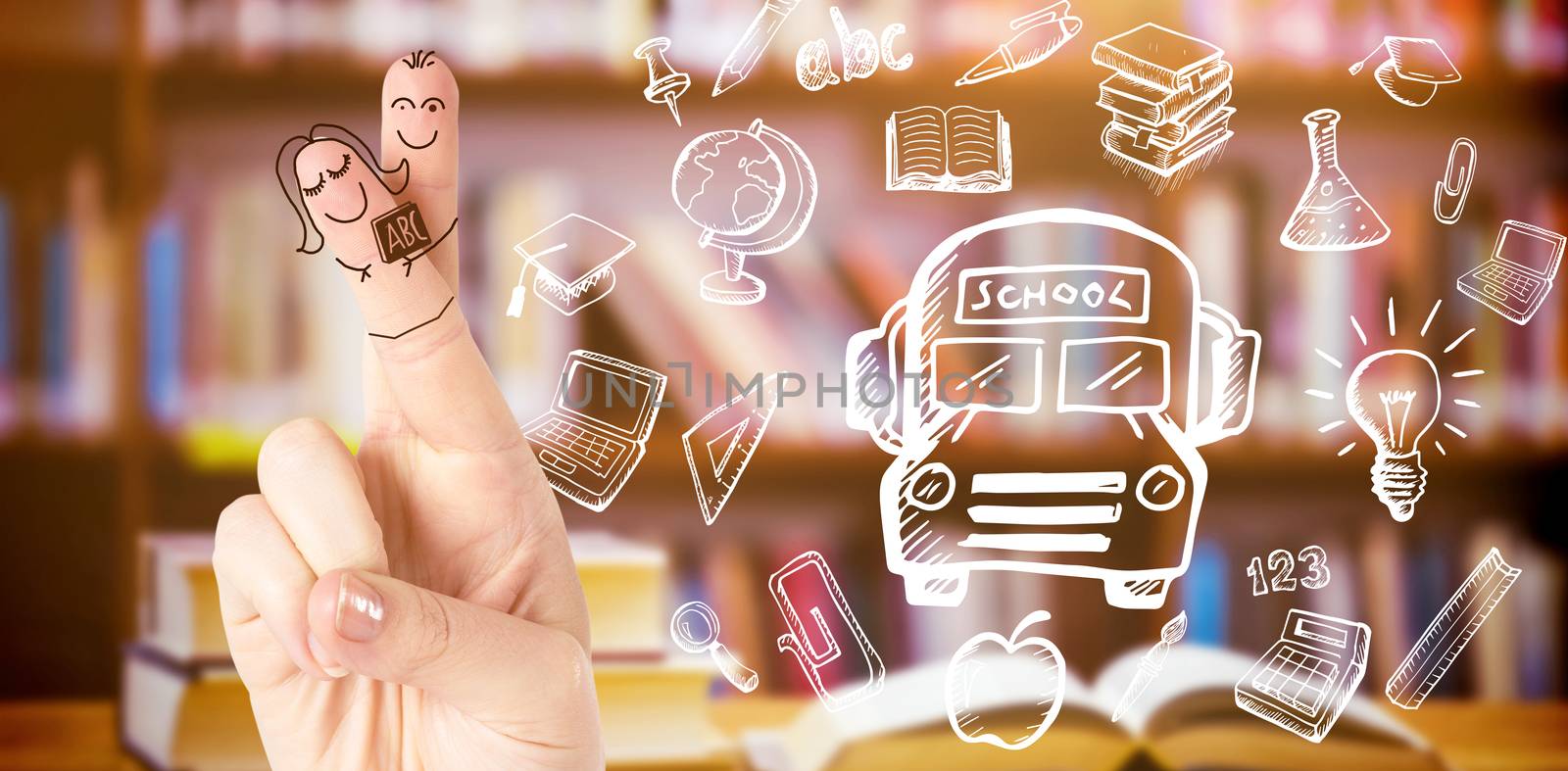 Fingers posed as students against books on desk in library