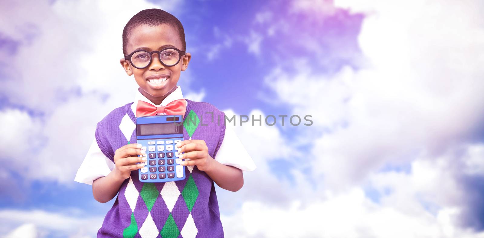 Happy pupil with calculator  against blue sky with white clouds