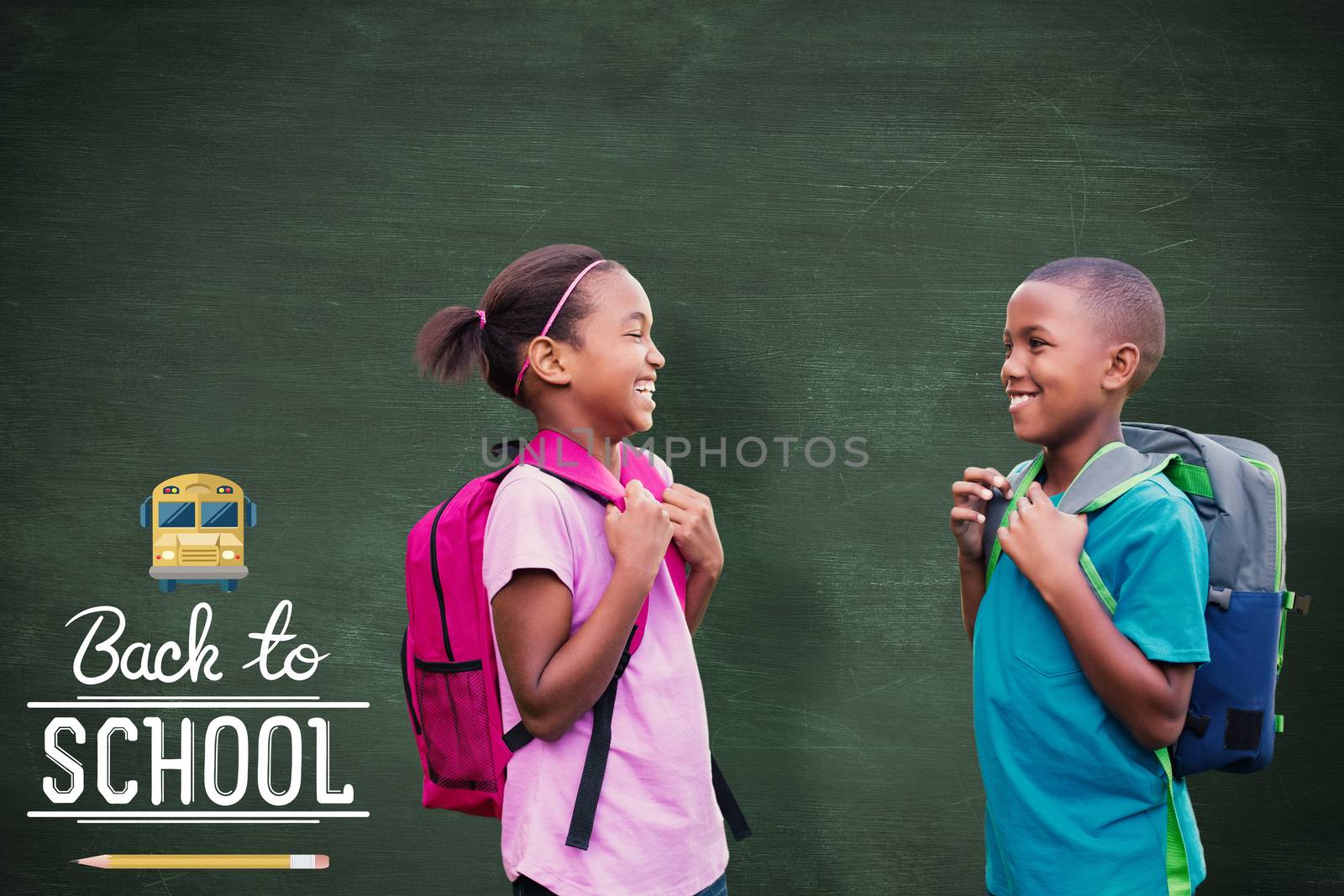 Smiling pupils against green chalkboard