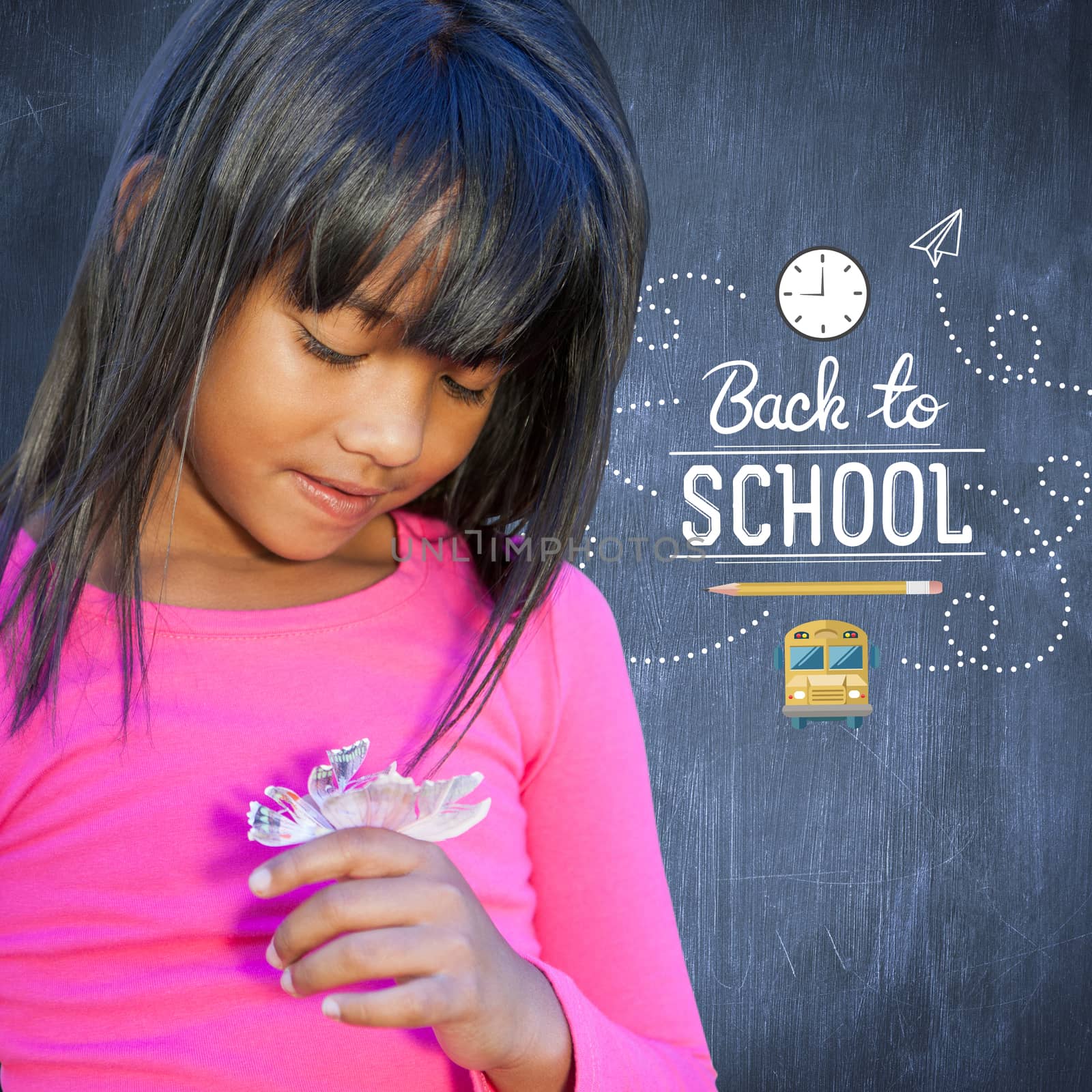 Cute little girl holding flower against blue chalkboard