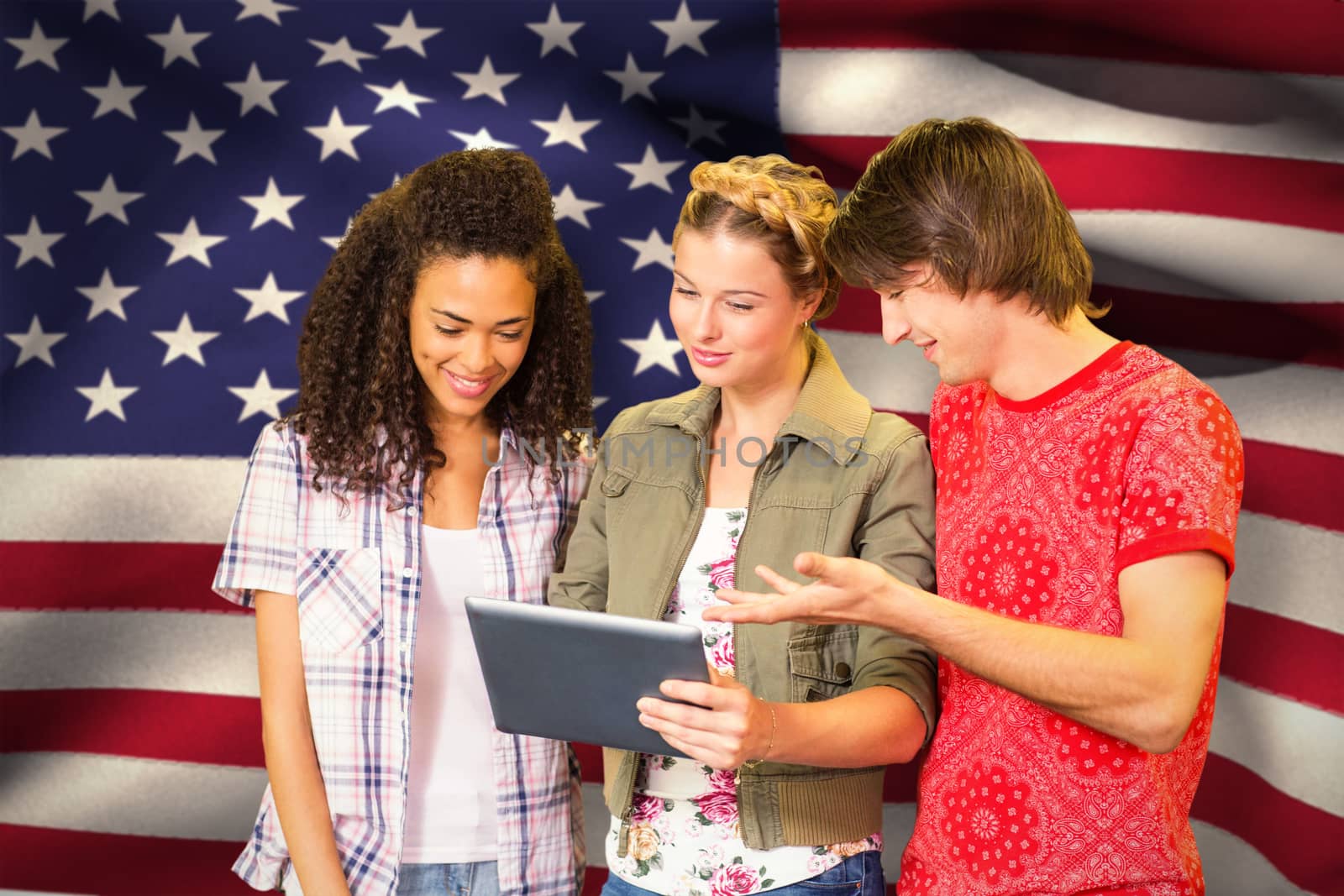 Students using digital tablet in library against digitally generated american national flag