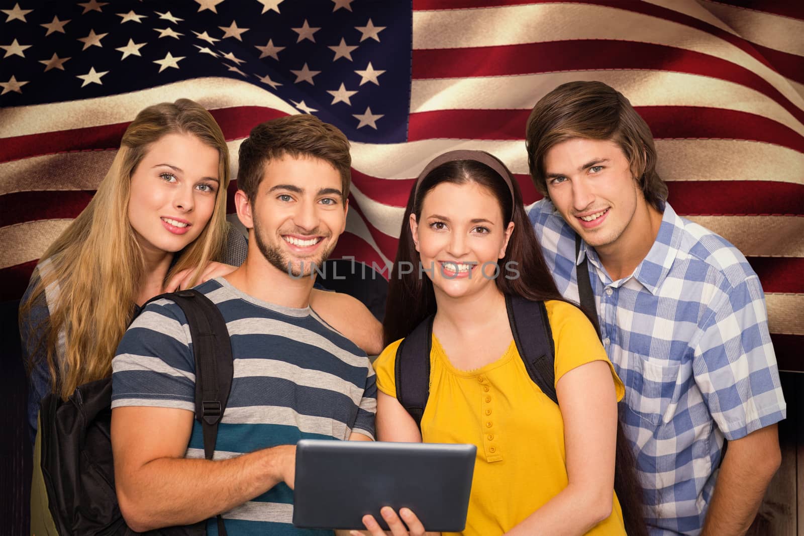 Students using digital tablet at college corridor against composite image of digitally generated united states national flag