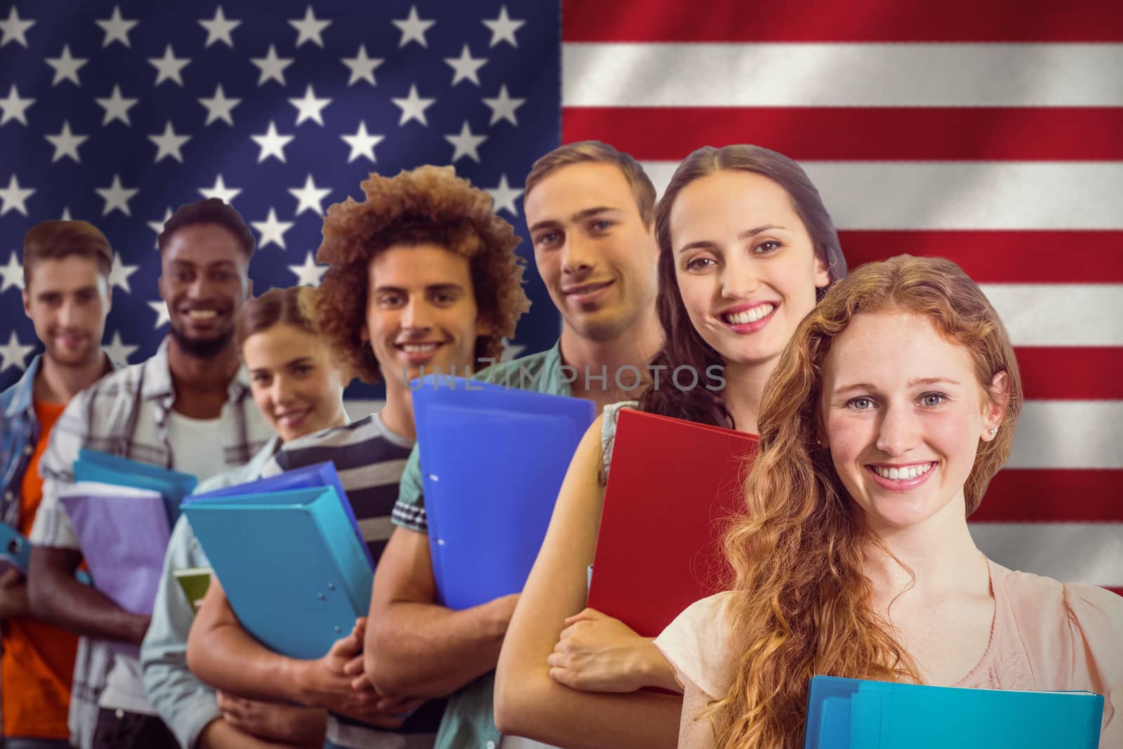 Fashion students smiling at camera together against digitally generated american national flag