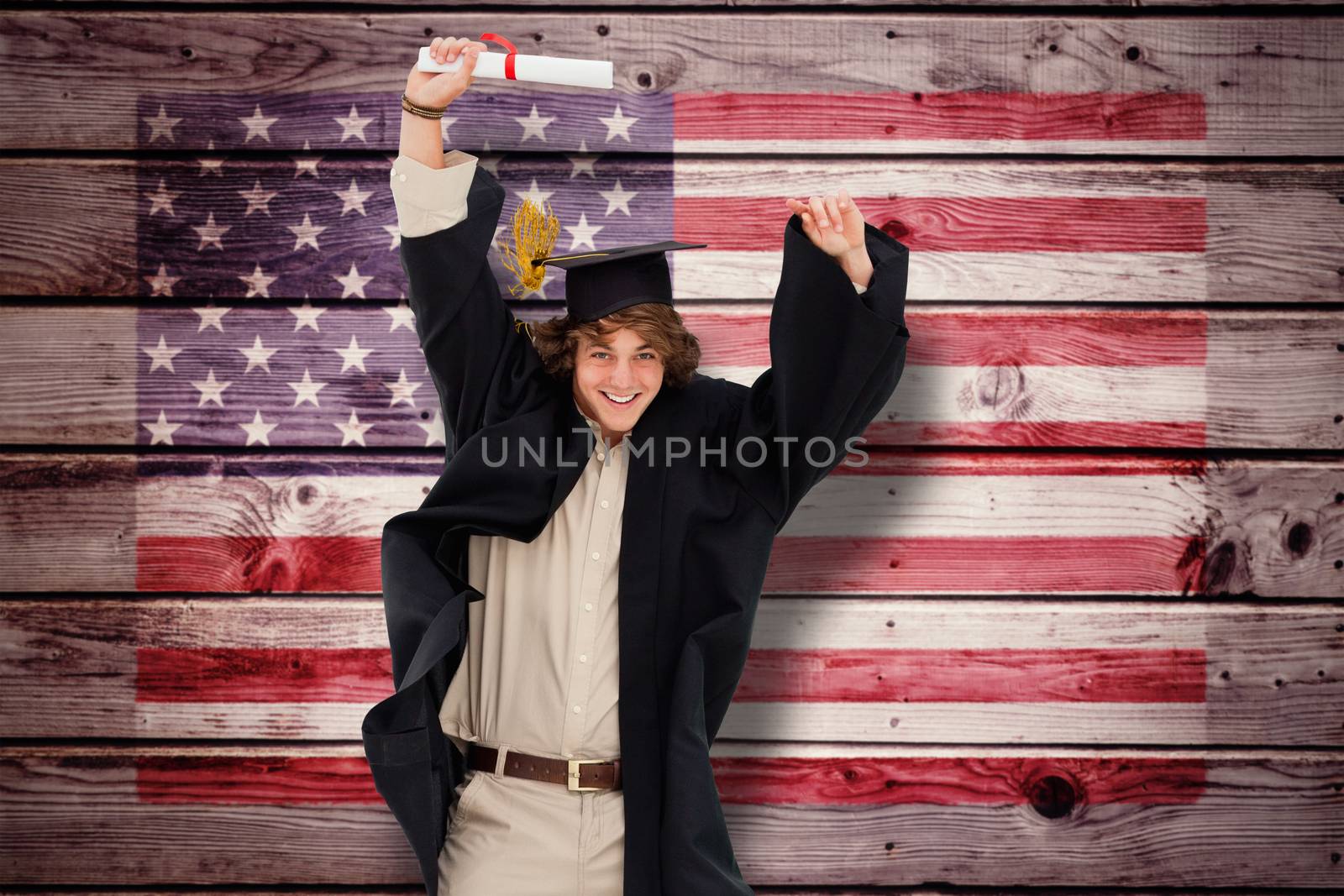 Male student in graduate robe jumping against composite image of usa national flag