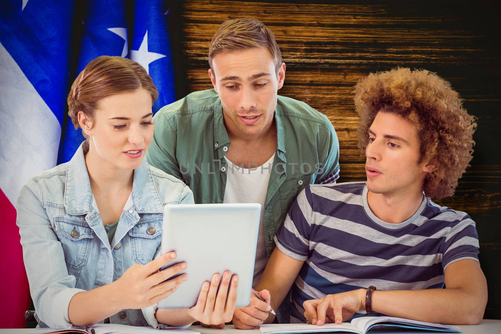 Fashion students using tablet  against usa flag on table
