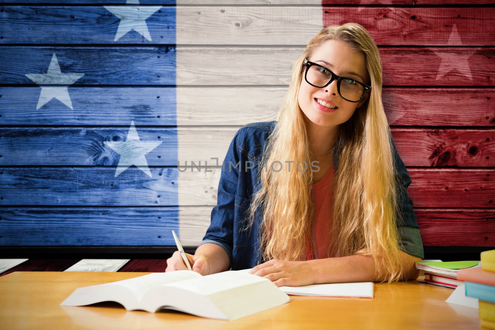 Composite image of student studying in the library  by Wavebreakmedia