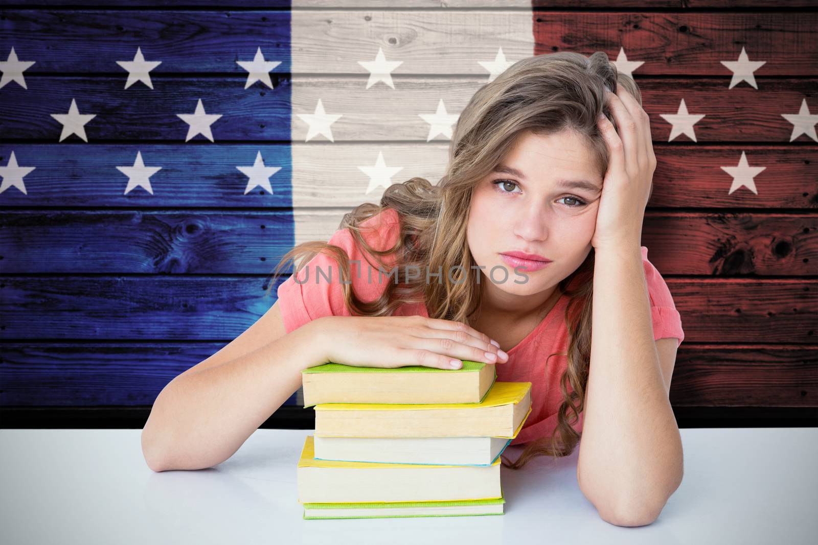 Tired hipster lying on table  against composite image of usa national flag