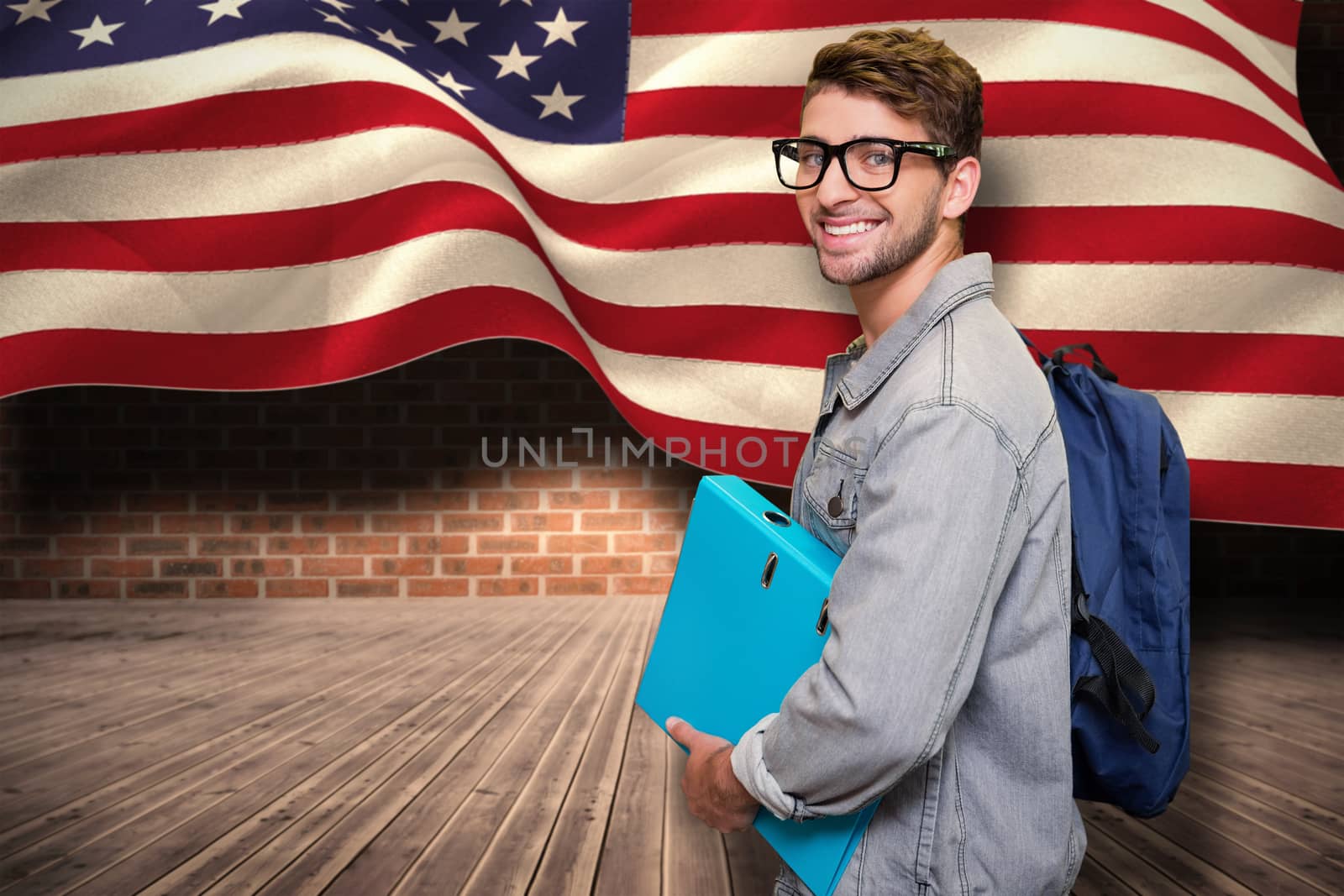Student smiling at camera in library against composite image of digitally generated united states national flag
