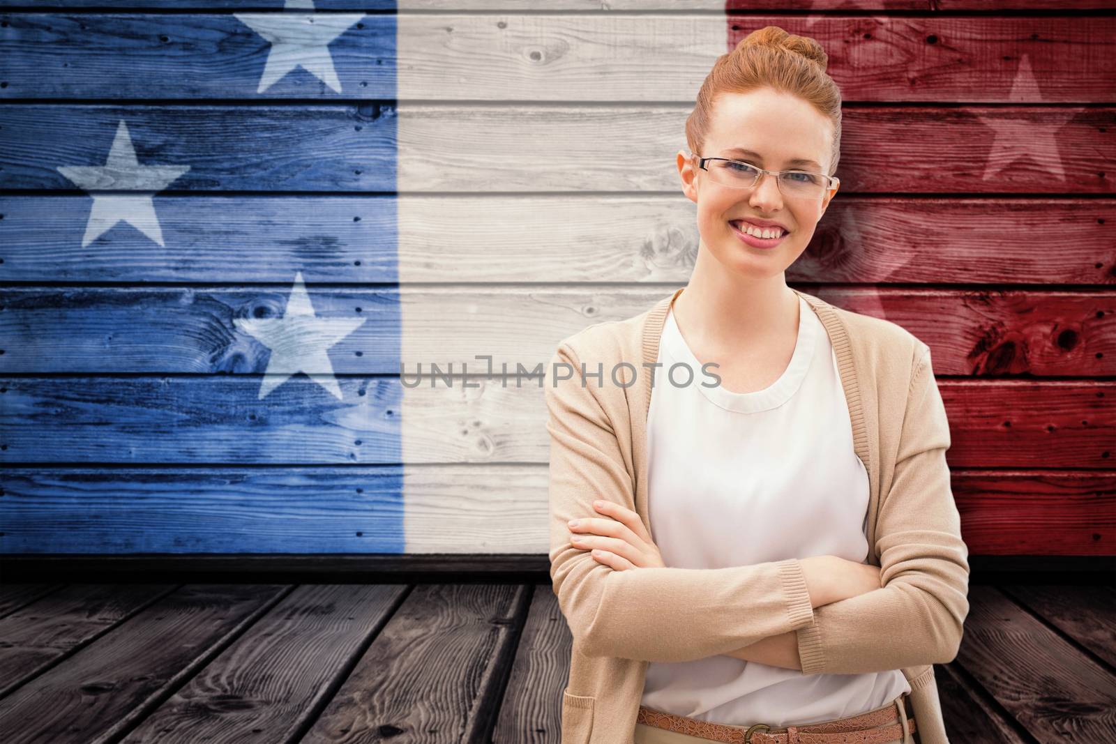 Smiling teacher against composite image of usa national flag