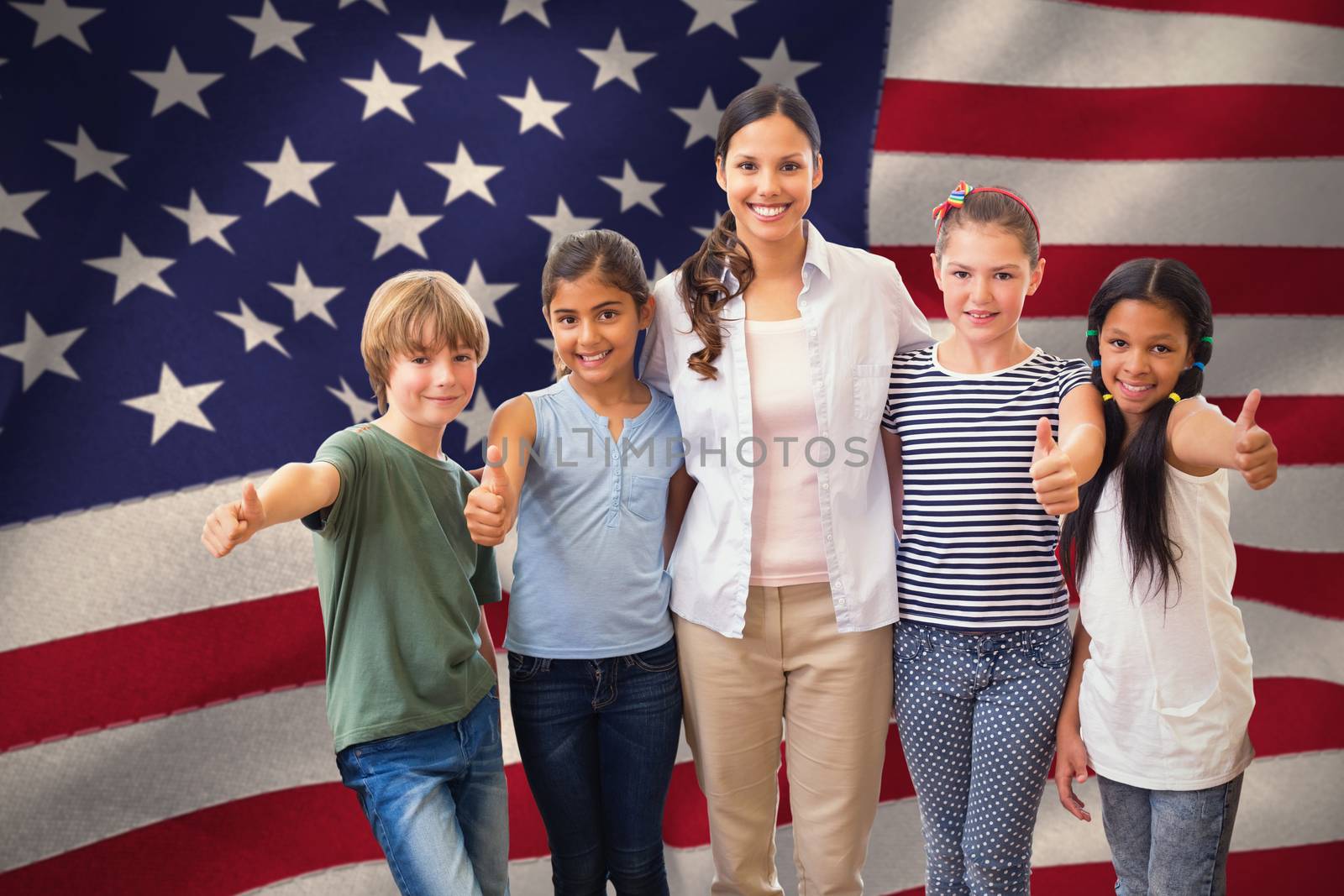 Cute pupils and teacher smiling at camera in computer class  against united states of america flag