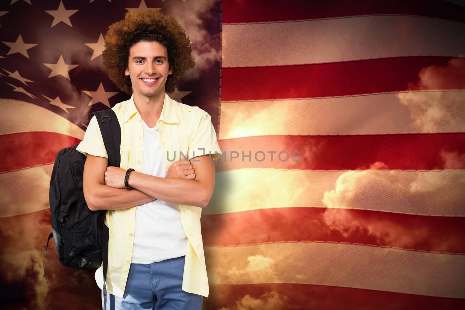 Composite image of young man with arms crossed in office corridor by Wavebreakmedia