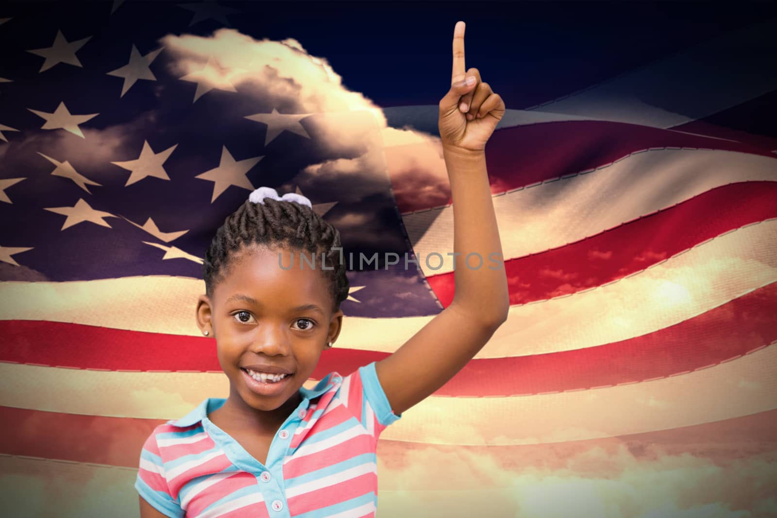 Smiling pupil with hand up against composite image of digitally generated american flag rippling