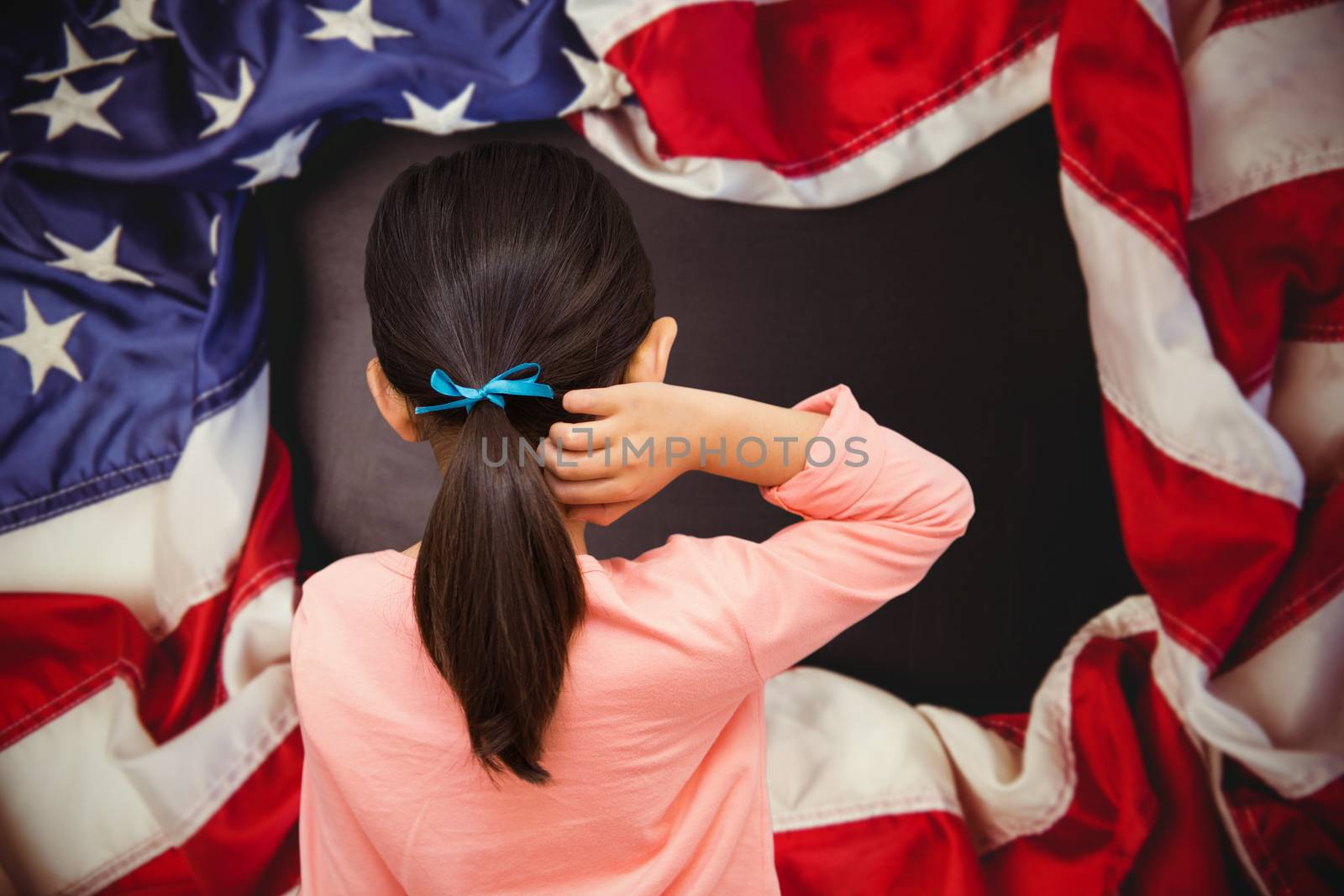 Pupil against american flag on chalkboard
