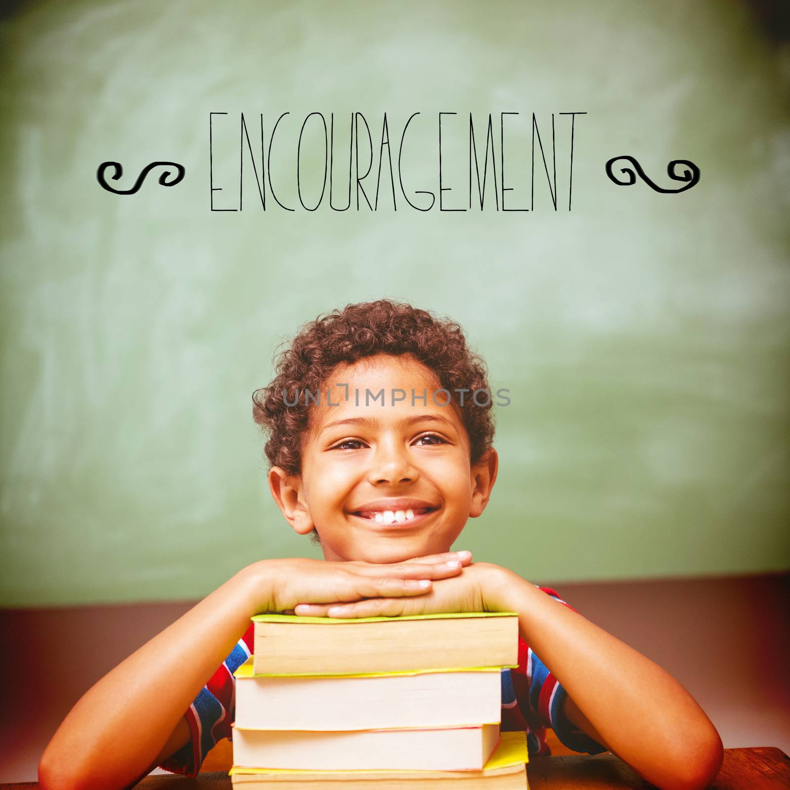The word encouragement against little boy with stack of books in classroom