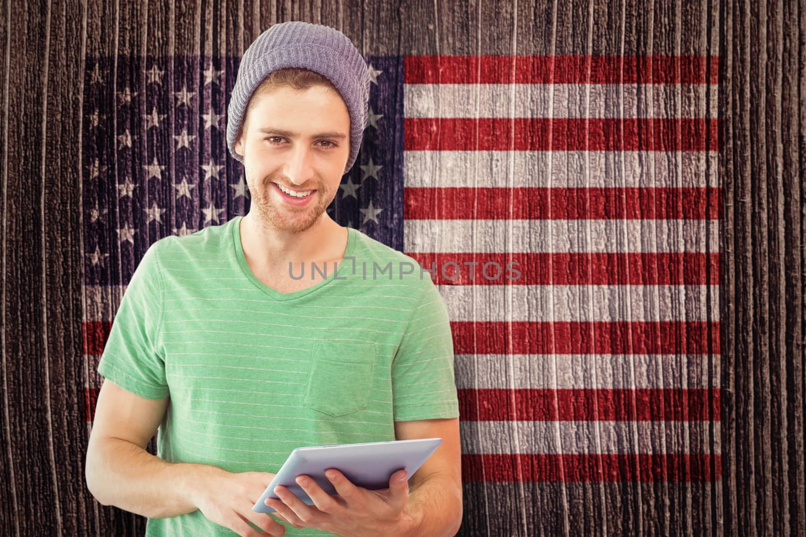 Student using tablet against composite image of usa national flag
