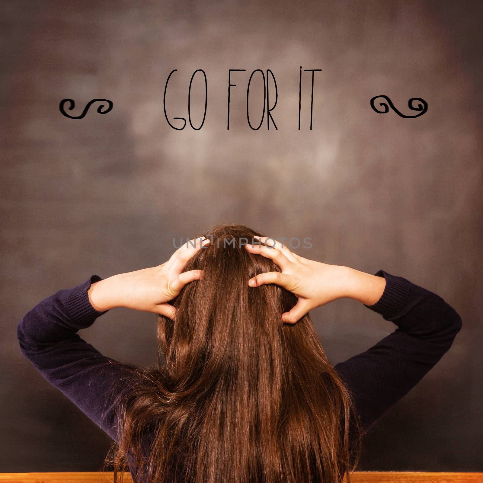 Go for it! against confused pupil looking at chalkboard by Wavebreakmedia