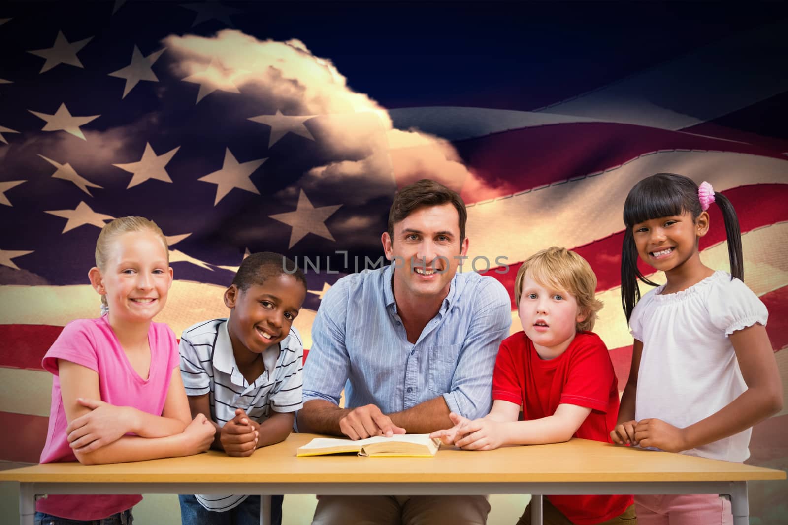 Teacher and pupils smiling at camera at library  against composite image of digitally generated american flag rippling