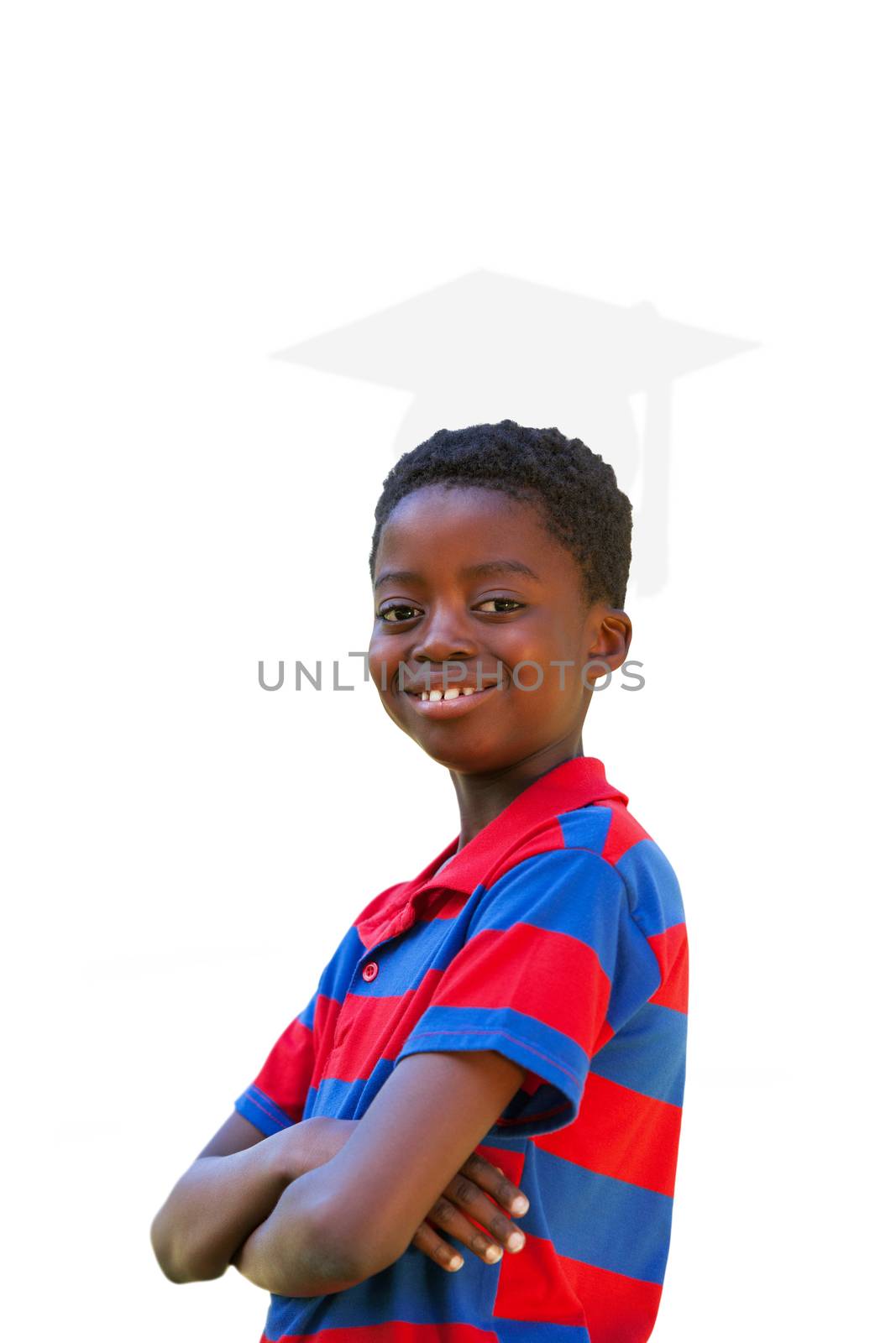 Cute little boy smiling at camera against silhouette of graduate