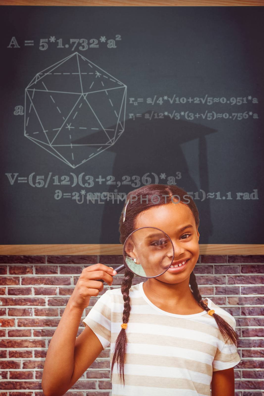 Composite image of happy pupil with magnifying glass by Wavebreakmedia