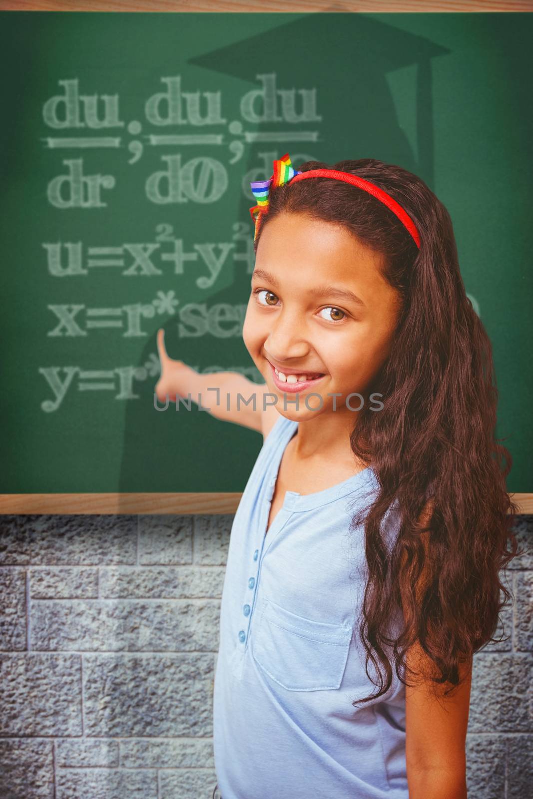 Composite image of happy pupil pointing by Wavebreakmedia