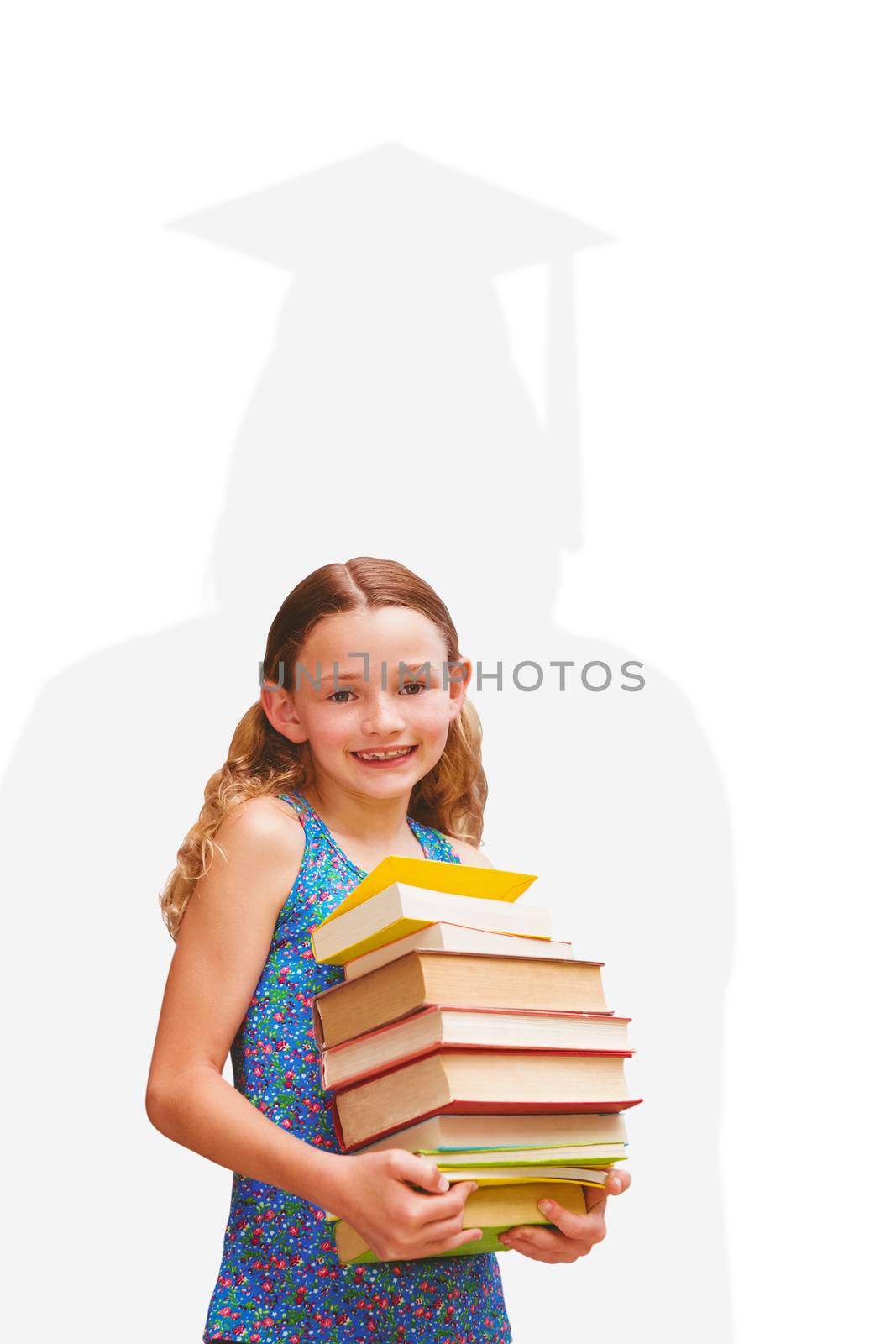 Composite image of cute little girl carrying books in library by Wavebreakmedia