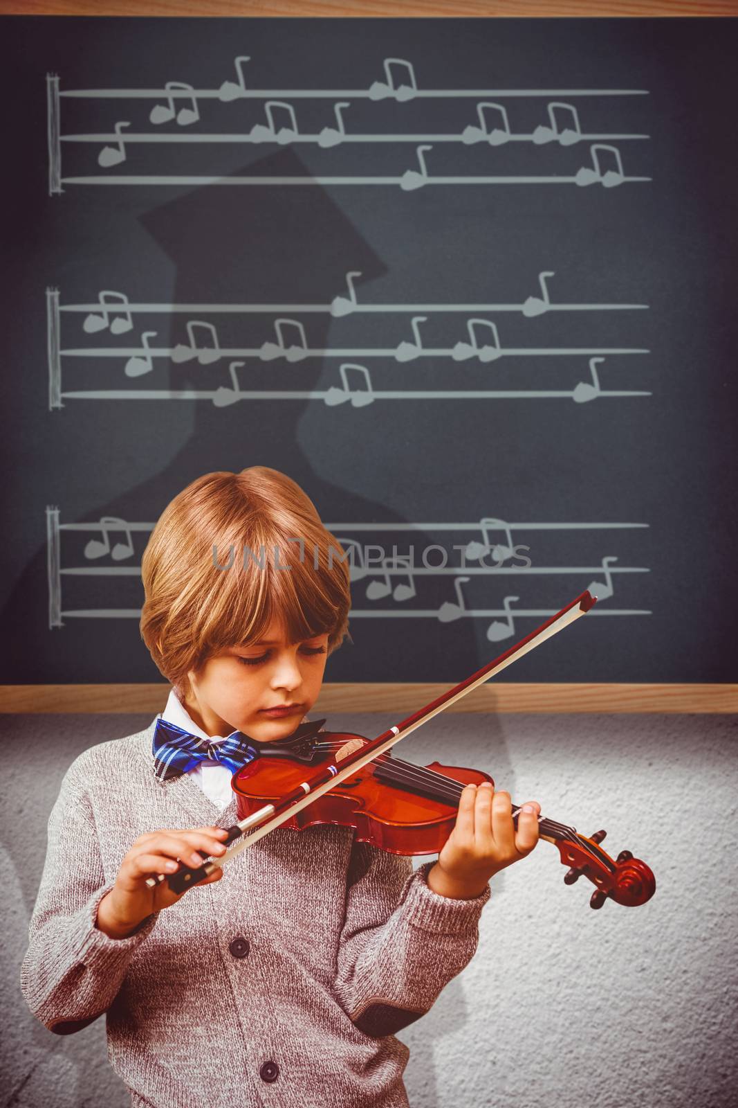 cute little boy playing violin  against teal, blue