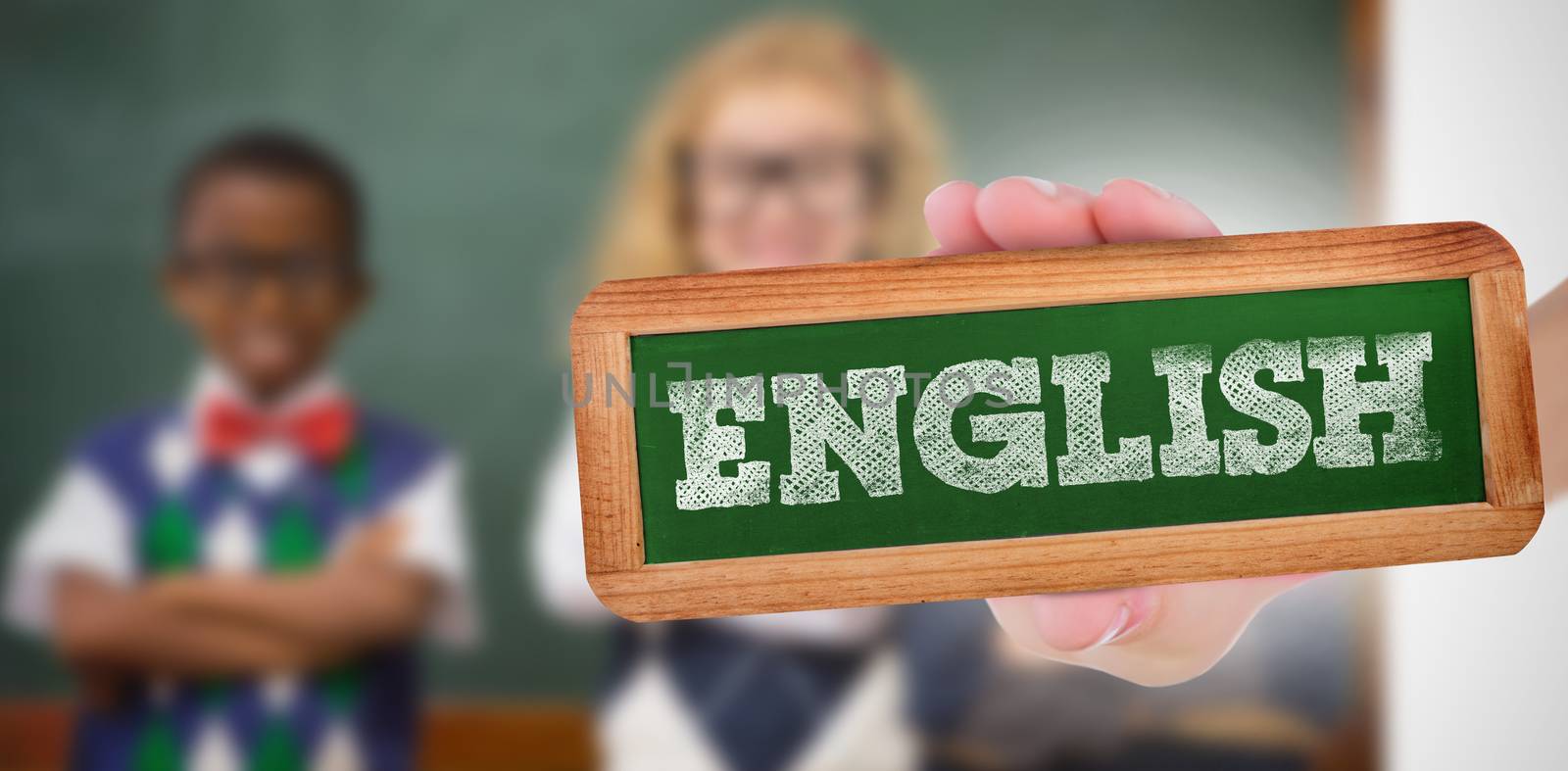 The word english and hand showing chalkboard against pupils smiling at camera with arms crossed 