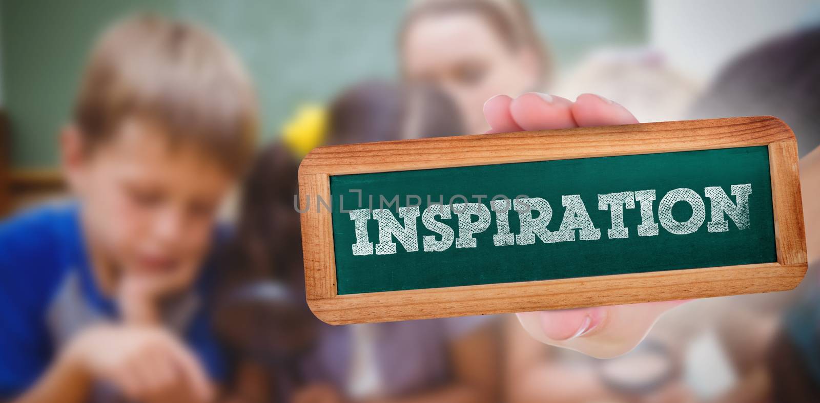 The word inspiration and hand showing chalkboard against cute pupils looking through magnifying glass