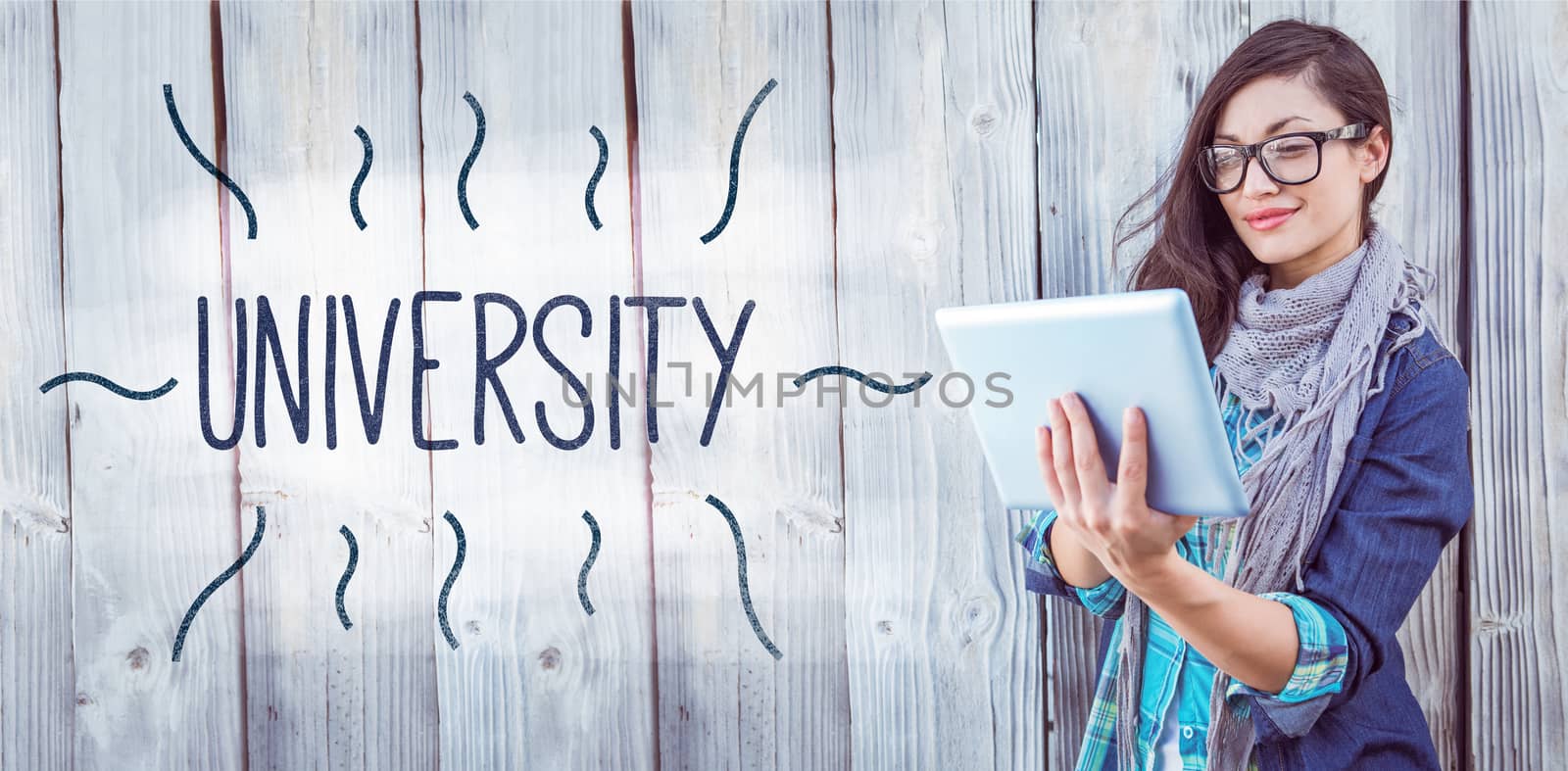 The word university against hipster using tablet pc