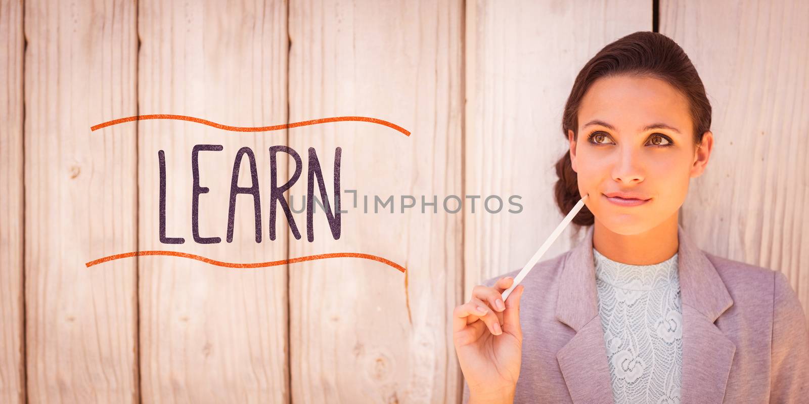 The word learn against stylish brunette thinking and smiling