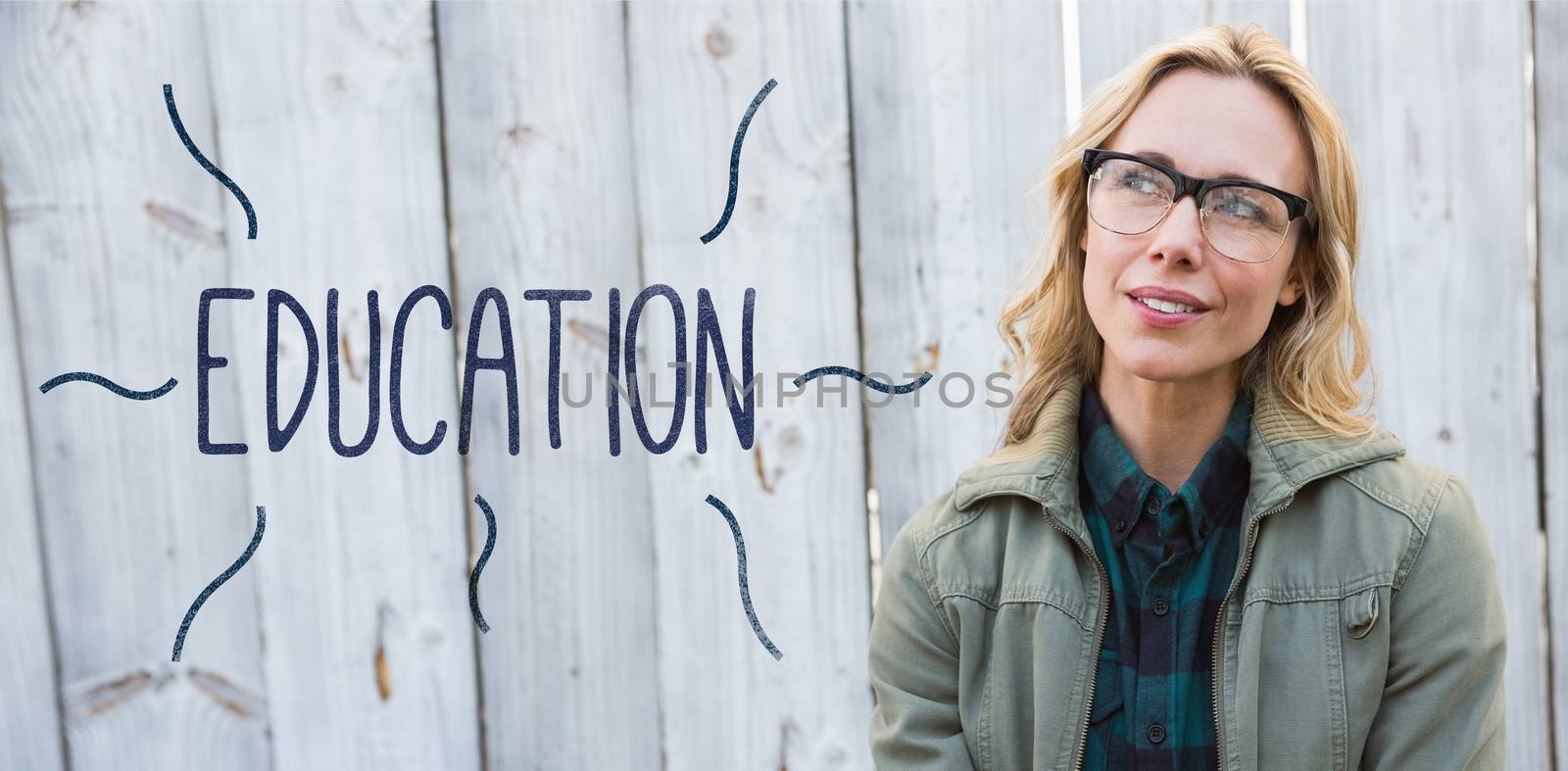 Education against blonde in glasses posing and thinking by Wavebreakmedia
