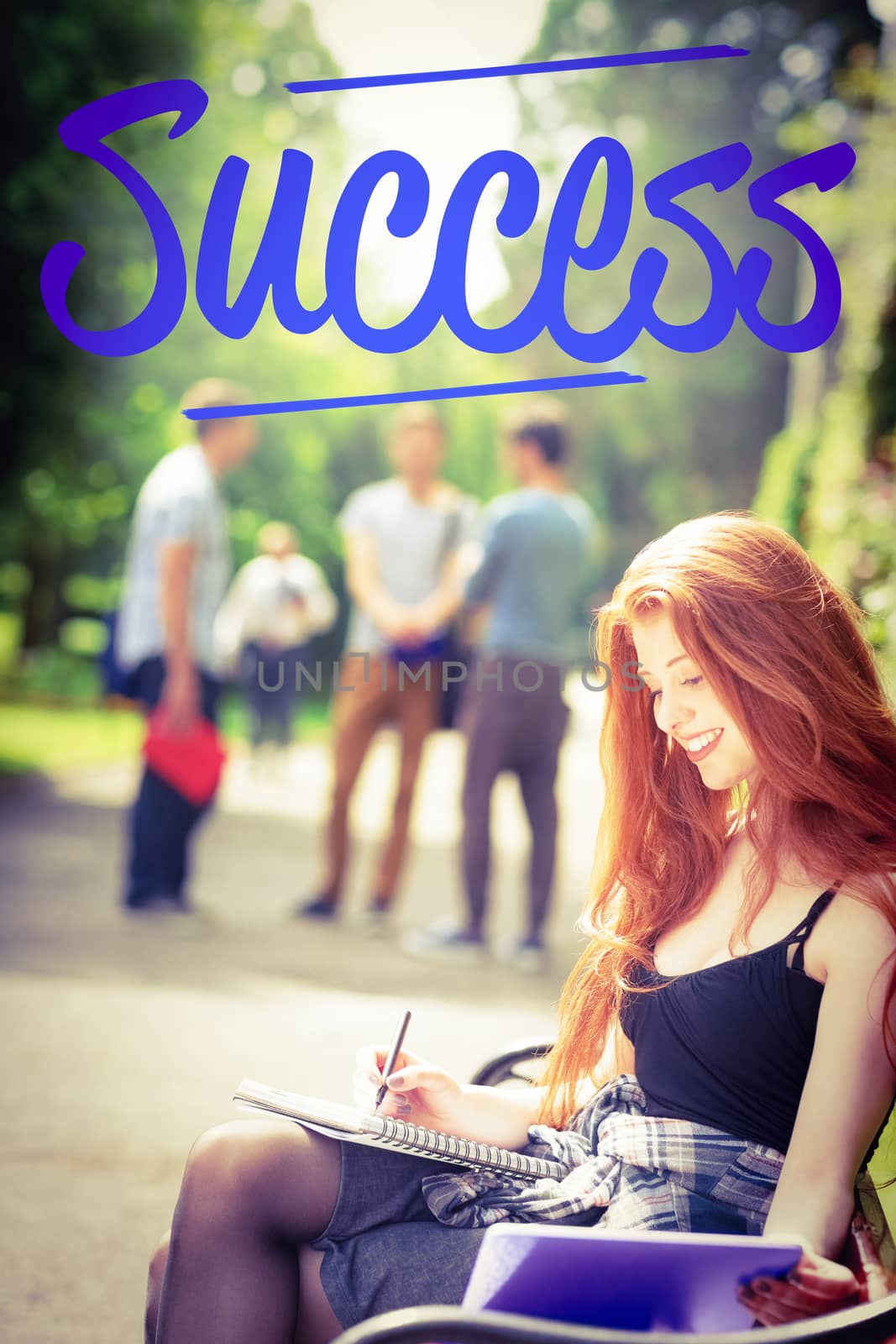 Success against pretty student studying outside on campus by Wavebreakmedia